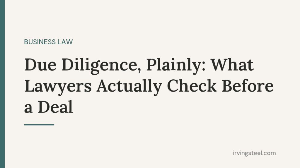 Document binders and magnifying glass representing legal due diligence in a business transaction